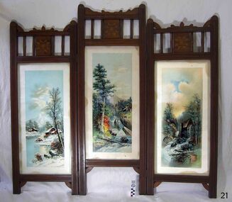 Wooden screen with three hinged panels, each with a coloured print behind glass