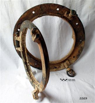 Brass porthole frame has hinged glass window frame, without the glass