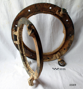 Brass porthole frame has hinged glass window frame, without the glass