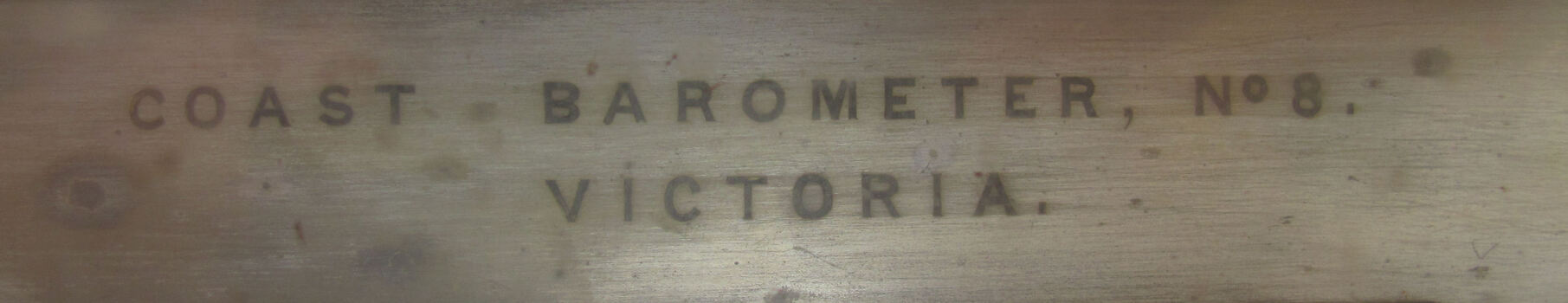 Text engraved on metal, COAST BAROMETER NO. 8 VICTORIA