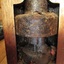 Base is a heavy metal chamber encased by a timber frame.