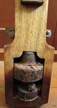 Timber around the barometer has fixing points to mount it into the cast metal case