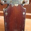 Fixtures are on the back on the timber case, including screws and bolts