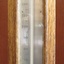 Glass window is neatly framed with narrow timber, showing the thermometer