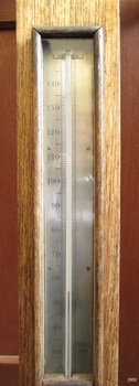 Glass window is neatly framed with narrow timber, showing the thermometer