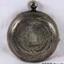 Front of the watch case, etched in a decorative pattern