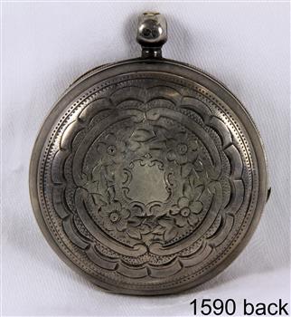 Front of the watch case, etched in a decorative pattern
