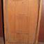 Wooden fitted case for clock, with door opening for winding the nechanism