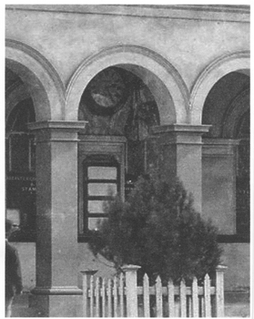 Black and white photograph of the clock in use on the Post Office wall