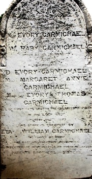 White headstone with Carmichael family names inscribed