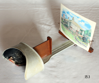 Wooden and metal stereoscope with clips to hold stereograph photographs