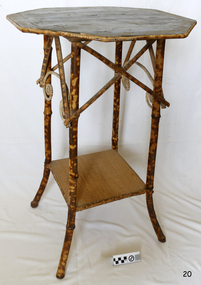Fine small table with a bamboo frame, hexagonal timber top and square timber base. Legs are turned slightly outwards at the ends.
