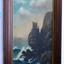 There are hight rocky cliffs on the right side of the painting. On the top of highest cliff is a lighthouse and flagstaff. There are birds like seagulls flying. Waves are crashing and foaming on the base of the cliffs.