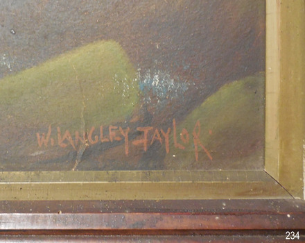 Painted using red-brown paint, in capital letters “W. LANGLEY-TAYLOR.”