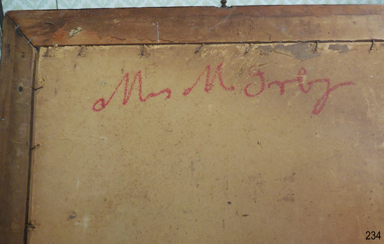 Handwritten in thick red crayon or pencil, in script “Mrs M Irby”.