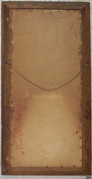 The handwritten inscription is sideways along the lower left edge of the painting’s board. The board is held in place inside the timber frame with small metal tacks around all sides. Metal eyes join the wire to the frame. The wire is hanging in a downward curve. Small round nail heads are dispersed around the frame and there is a change of colour on both the board and the wood; perhaps from having a backing paper taped and tacked to the back. The mitred corners of the frame have been strengthened with staples. There is some damage to the board.