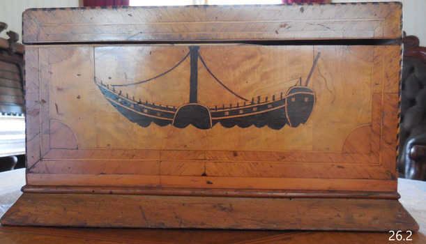 Inlaid image of a paddle steamer boat with a tall funnel and paddle wheel.