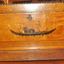 Inlaid image depicts figures on a gondola. 