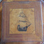 Inlaid image of a fully rigged ship. 