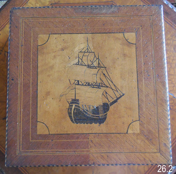 Inlaid image of a fully rigged ship. 