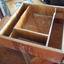 The removable tray of the box has been divided into compartments.