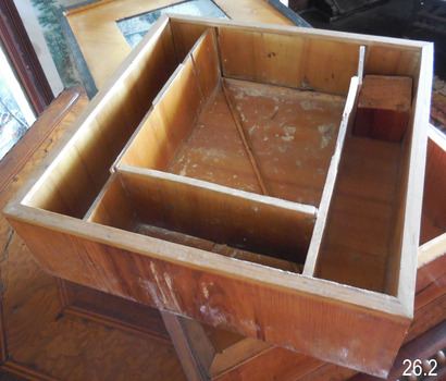 The removable tray of the box has been divided into compartments.