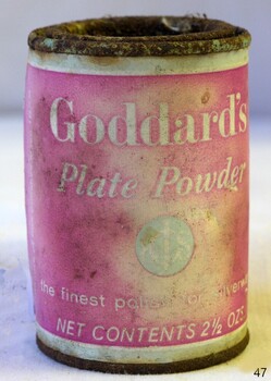 Upright container has coloured label with text and logo