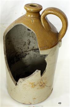 Ceramic jug with small handle and narrow mouth, dark brown top, cream base