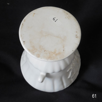 Round white base of vise has the registration number on it