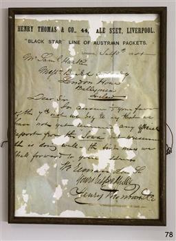 Timber and glass frame enclosing original handwritten letter