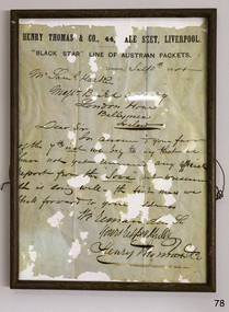 Timber and glass frame enclosing original handwritten letter