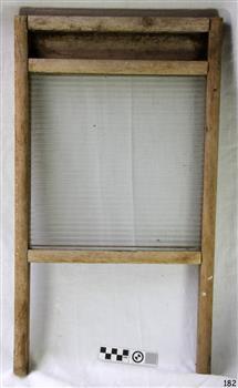 Rectangular ribbed glass pane within a wooden frame with two legs.