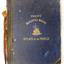 Large book, blue cover, black spine and corners, embossed gold letters, image of gold ship on water