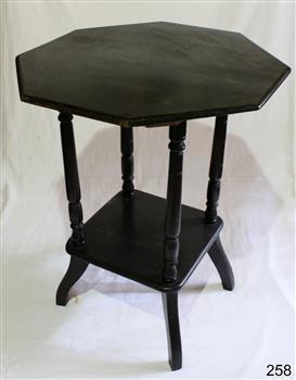 Dark wood octagonal table with square shelf near base, set between the four rounded legs