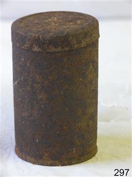 A round tin container with lid. Very rusty.