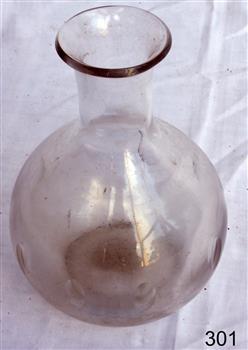 Clear glass carafe with narrow neck and bulbous base