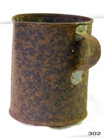 A round metal jug with handle soldered on side. In very bad condition. Rusty all over.