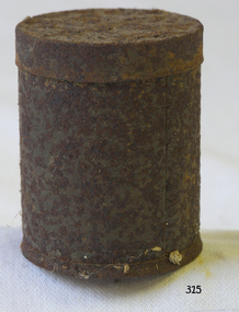 A round tin container with lid. Very rusty.
