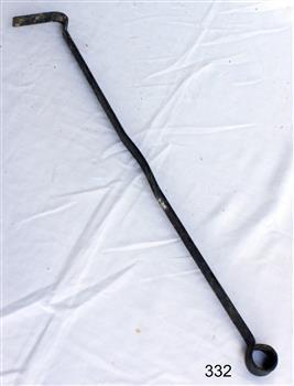Metal poker has a circular handle and an 'L' shaped end.