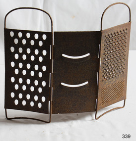 A metal grater with three hinged sides for grating different sizes and types of food.