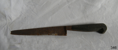 Metal kitchen knife with serrated edged blade and wooden handle