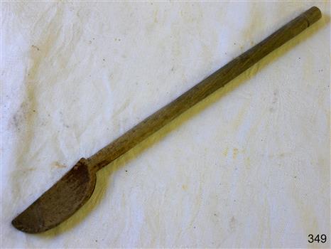 Wooden spoon with long handle and scoopd bowl