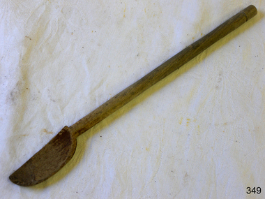 Wooden spoon with long handle and scoopd bowl