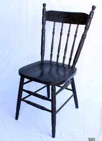  Wooden dark varnished dining chair with four vertical stretchers, and two rungs running the whole way around the legs, although at different heights.