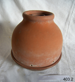 Terra cotta cooler, probably used to keep butter or cheese cool.