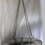 Breeches buoy suspended from hawser line on a traveller block. Similar to a zip wire.
