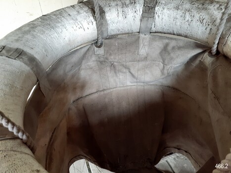 Top of breeches buoy has a lifebuoy ring  joined on with eyelets, ropes and straps