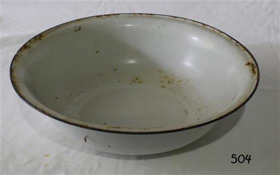 A round metal bowl with white enameled finish and blue rim around the top edge.