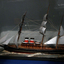 Three-masted ship with two steam funnels