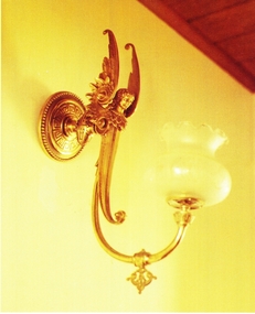 Shining lamp with angelic figure on bracket